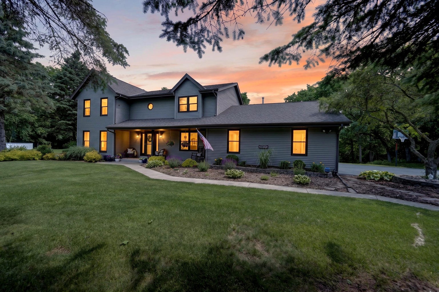 Updated Colonial home at twilight on 1.86 wooded acres,
                    N6W31264 Alberta Drive, Delafield Wisconsin